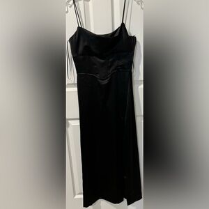 Black satin feel (100% polyester) halter evening dress. Like new. Worn once.